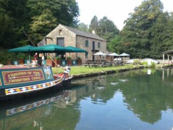 Canal with boat and cafe